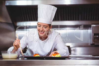 Chef putting sauce on a dish