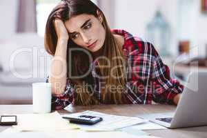 Frustrated young woman with laptop