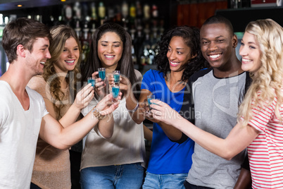 Group of friends having shots