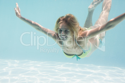 Beautiful woman swimming in pool Beautiful woman swimming in pool