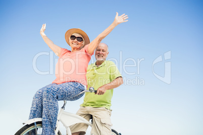 Senior couple going for a bike ride