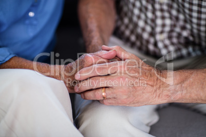 Senior couple holding hand