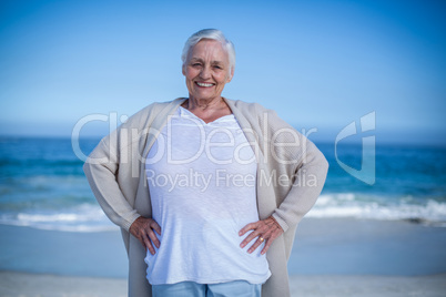 Pretty mature woman posing on the beach
