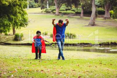 Father and son in superhero costume