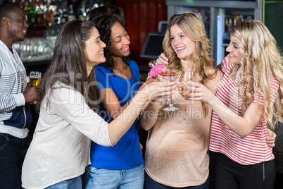 Friends drinking cocktails together