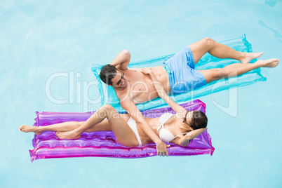 Couple enjoying on inflatable raft