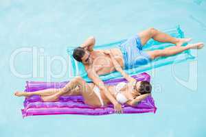 Couple enjoying on inflatable raft