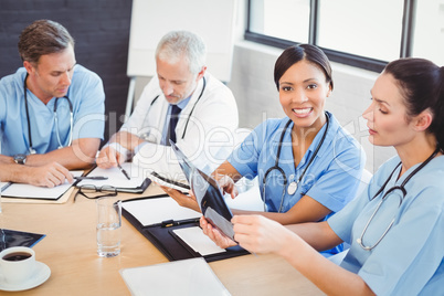 Portrait of female doctor smiling in conference room