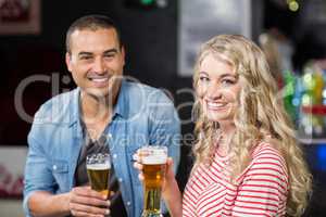 Smiling couple drinking beer