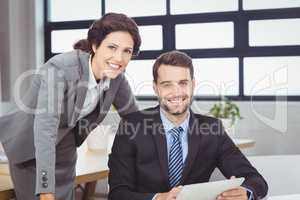 Confident young business people in office