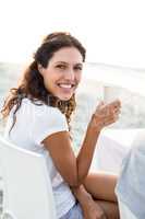 Smiling woman having a picnic