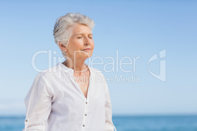 Senior woman relaxing on the beach