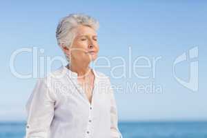 Senior woman relaxing on the beach