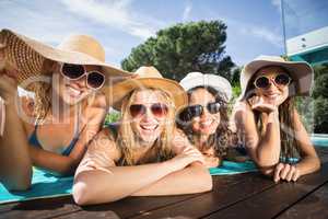 Happy friends enjoying at the swimming pool