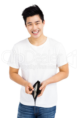 Portrait of young man showing wallet with currency note
