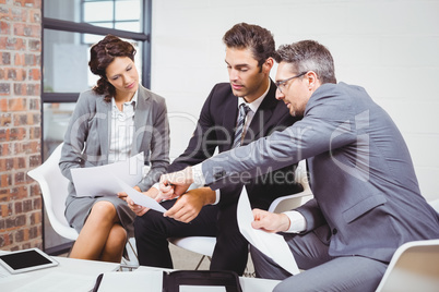 Business people holding documents