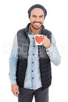 Happy young man holding coffee mug