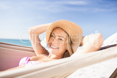 Woman lying in hammock