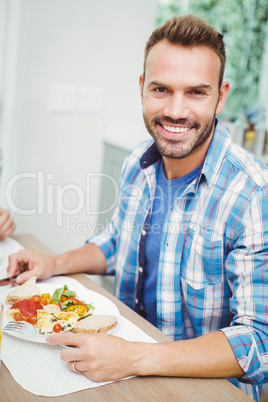 Portrait of smiling man having food Portrait of smiling man having food