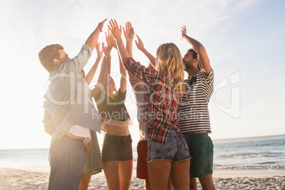 Happy friends giving high five