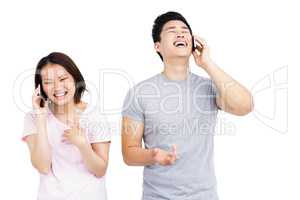 Young couple talking on mobile phone