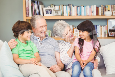 Grandchildren siiting with grandparents