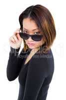 Woman looking over her sunglasses