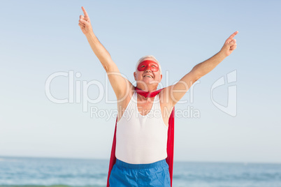 Senior man wearing superman costume