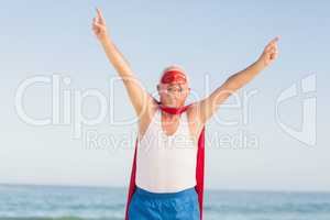 Senior man wearing superman costume