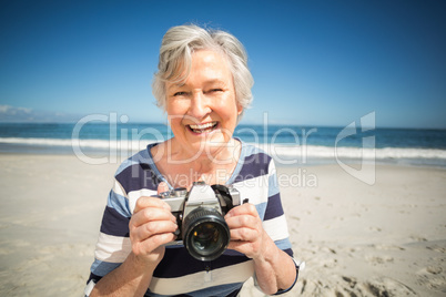 Senior woman taking picture