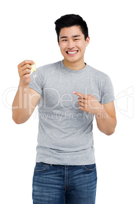 Happy man showing house key