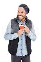 Happy young man holding coffee mug