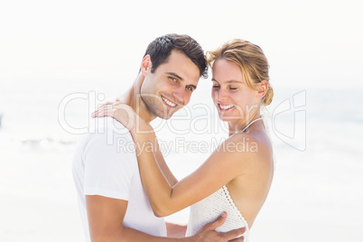 Young couple embracing on the beach