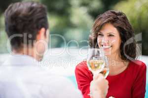 Couple toasting white wine