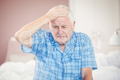 Senior man suffering from headache