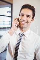Smart business professional talking on mobile phone