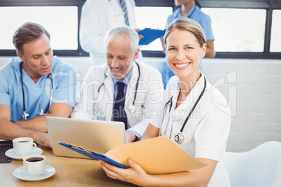 Female doctor holding a medical report