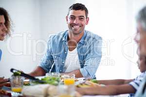 Man having breakfast with family
