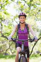 Smiling woman cycling