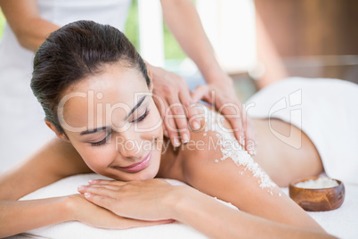 Beautiful young woman enjoying spa treatment