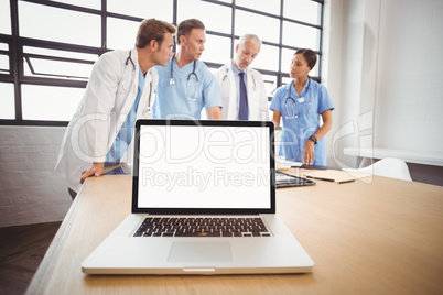 Laptop on table in conference room