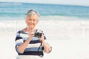 Senior woman taking picture