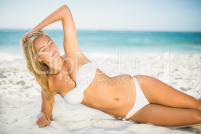 Relaxed woman posing at the beach