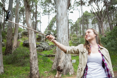 Smiling woman taking selfies