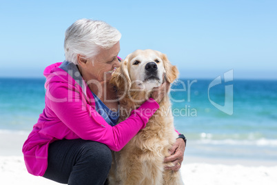 Cute mature woman petting her dog