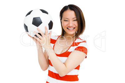 Young woman holding football