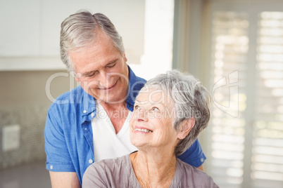 Happy romantic senior couple looking at each other