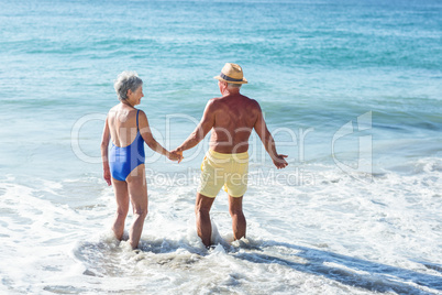 Senior couple walking on the water