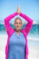 Thoughtful mature woman meditating