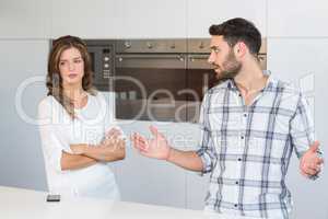 Man explaining upset woman at home
